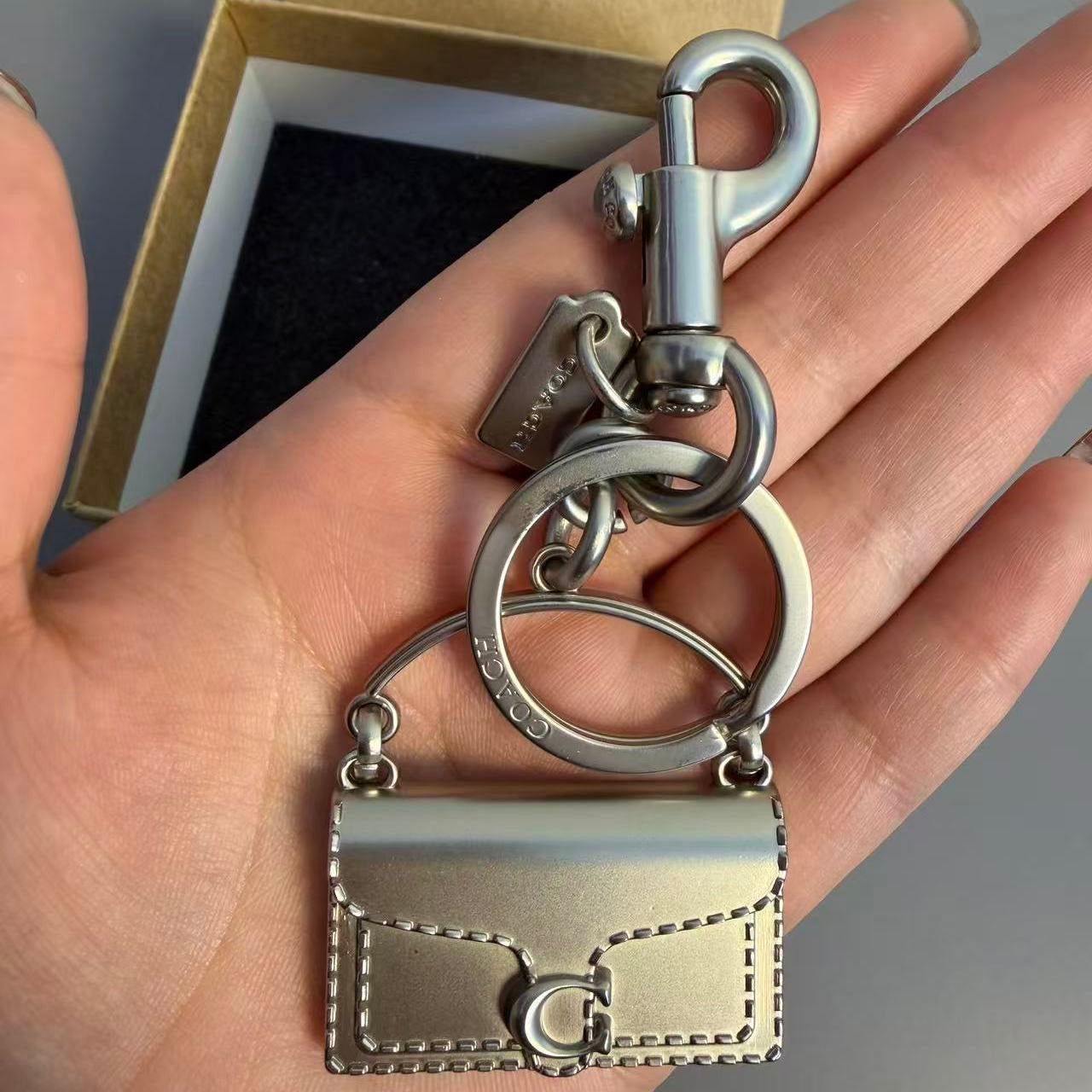 C O A C I-I Charm